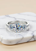 3 Carat Round Moissanite Three-Stone Ring in Platinum-Plated .925 Sterling Silver