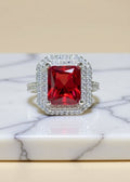 2 Carat Red Emerald-Cut Moissanite Double Halo Ring in Platinum-Plated 925 Sterling Silver