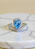 1 Carat Sky Blue Pear-Cut Moissanite Halo Ring in Platinum-Plated .925 Sterling Silver