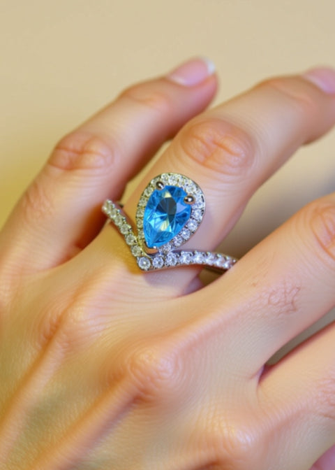 1 Carat Sky Blue Pear-Cut Moissanite Halo Ring in Platinum-Plated .925 Sterling Silver