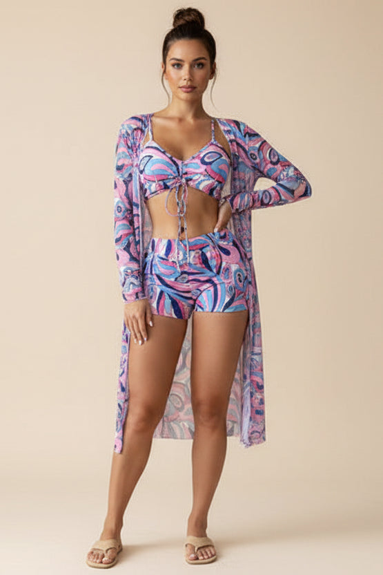 Person wearing a colorful bikini and cover-up in a living room.