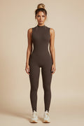 Brown sleeveless jumpsuit worn by a model on a white background