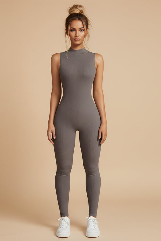 Woman wearing a gray ribbed bodysuit on a white background