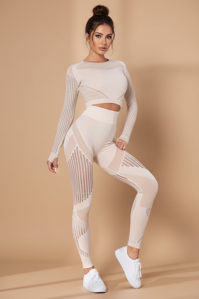 Woman wearing a beige athletic outfit on a white background