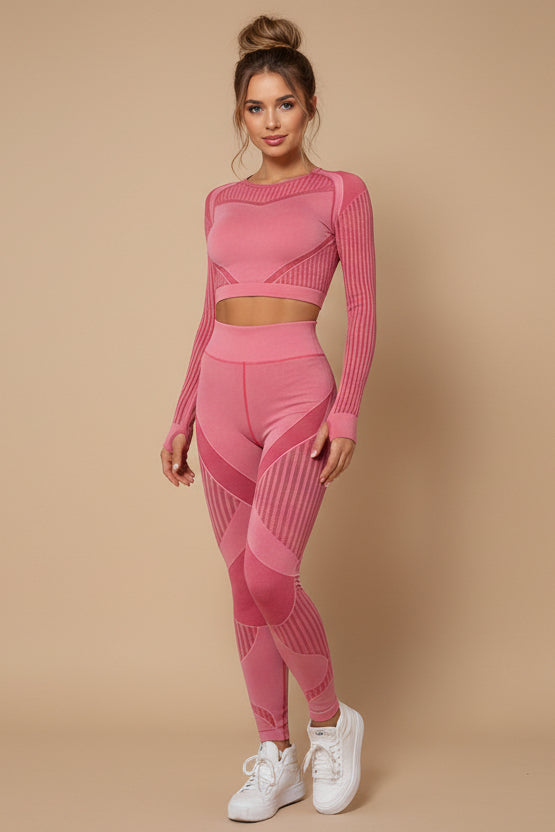 Woman wearing a pink athletic outfit on a white background