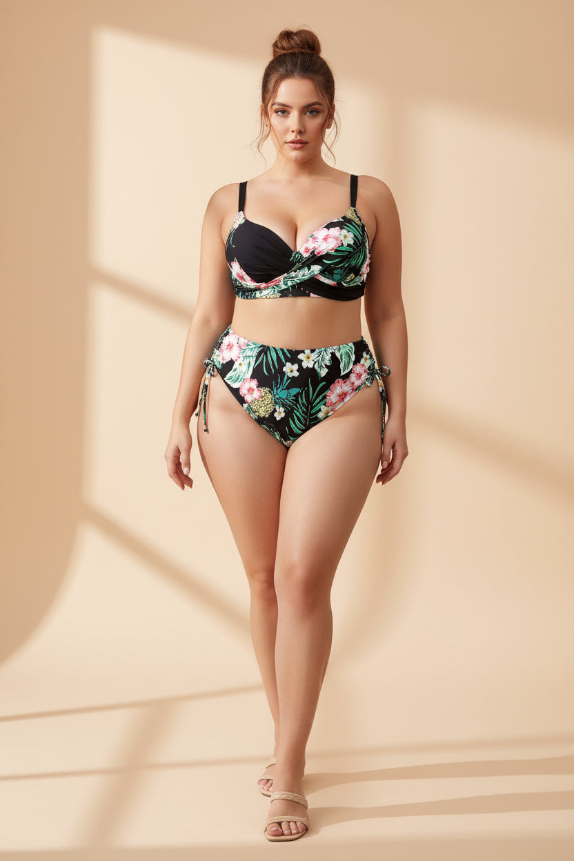 Woman wearing a black floral bikini set on a white background