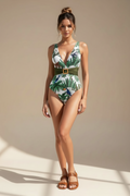 Woman wearing a tropical print swimsuit with sunglasses in a sunlit outdoor setting